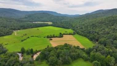 Flying over Beebe River in the Campton Mountain near Bumps Covered Bridge with White Mountain National Forest at the background in town of Campton, New Hampshire NH, USA. 