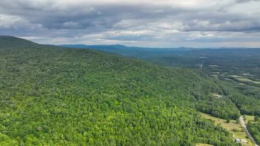 Stinson Mountain, Tenney Mountain and Baker River valley between them from top of Rumney historic center aerial view in summer in White Mountain National forest, Rumney, New Hampshire NH, USA. 