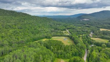 Stinson Mountain, Tenney Mountain and Baker River valley between them from top of Rumney historic center aerial view in summer in White Mountain National forest, Rumney, New Hampshire NH, USA. 