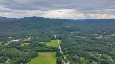 Stinson Mountain, Tenney Mountain and Baker River valley between them from top of Rumney historic center aerial view in summer in White Mountain National forest, Rumney, New Hampshire NH, USA. 