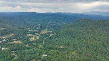 Stinson Mountain, Tenney Mountain and Baker River valley between them from top of Rumney historic center aerial view in summer in White Mountain National forest, Rumney, New Hampshire NH, USA. 