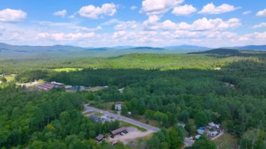 Aerial view the Plymouth rural landscape near Tenney Mountain in summer with White Mountain National Forest at the background in town of Plymouth, New Hampshire NH, USA. 