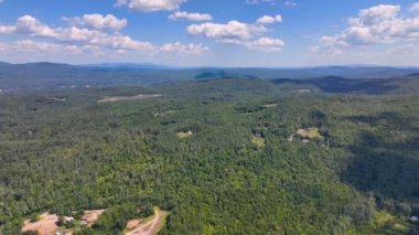 Aerial view the Plymouth rural landscape near Tenney Mountain in summer with White Mountain National Forest at the background in town of Plymouth, New Hampshire NH, USA. 