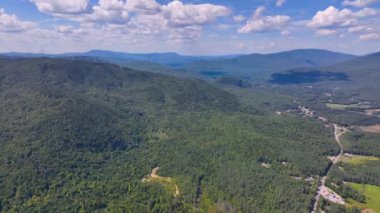 Aerial view the Plymouth rural landscape near Tenney Mountain in summer with White Mountain National Forest at the background in town of Plymouth, New Hampshire NH, USA. 