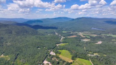 Aerial view the Plymouth rural landscape near Tenney Mountain in summer with White Mountain National Forest at the background in town of Plymouth, New Hampshire NH, USA. 