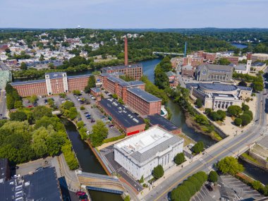 Boott Mills aerial view at the mouth of Concord River to Merrimack River in historic downtown Lowell, Massachusetts MA, USA.  clipart