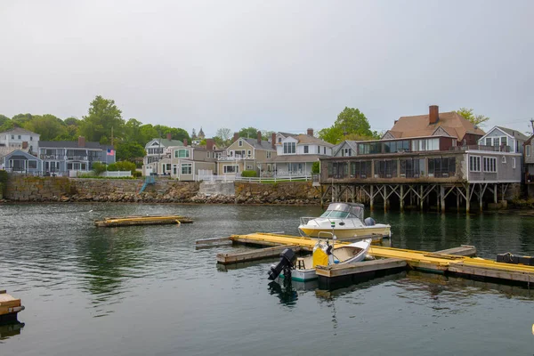 Rockport Harbor in a foggy day with fishing boat in historic town center of Rockport, Massachusetts MA, USA.