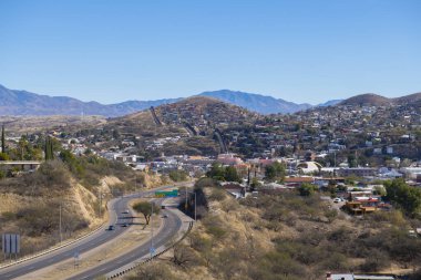 Aerial view of Nogales Sonora with Border Wall between Nogales Arizona USA and Nogales Sonora Mexico near International Street in city of Nogales, Arizona AZ, USA. 