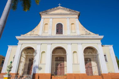 Holy Trinity Church (Iglesia de la Santisima Trinidad) at Plaza Mayor in historic city centre of Trinidad, Cuba. Historic Trinidad Centre is a World Heritage Site.  clipart