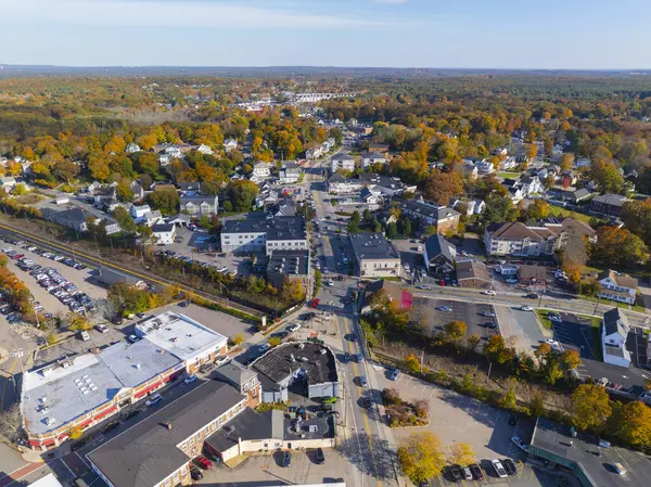 Franklin historic commercial center aerial view in fall on Main Street at Central Street, with railroad across the town center, Franklin, Massachusetts MA, USA.
