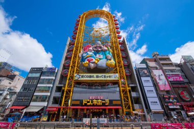 Ebisu Tower Ferris Wheel on Dotonbori Canal in Namba District, Chuo ward, city of Osaka, Japan.  clipart