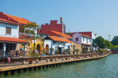 Historic waterfront house on Malacca River in city center of Melaka, Malaysia. Historic cities of the Strait of Malacca is a World Heritage Site.  clipart