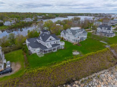 Historic coastal mansion aerial view in a cloudy at the coast of Hull near Cohasset, Massachusetts MA, USA.  clipart