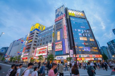 Sun Flower shopping mall with neon light at sunset on Ome-kaido Avenue and Otakibashi dori at Sinjukuogado West, Shinjuku City, Tokyo, Japan.  clipart