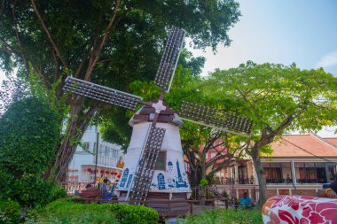 Windmill model on Jalan Gereja Street at Dutch Square in city center of Melaka, Malaysia. Historic cities of the Strait of Malacca is a World Heritage Site. clipart