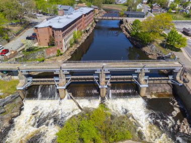 Woonsocket Falls Dam and Glenark Mills building on Blackstone River aerial view in downtown Woonsocket, Rhode Island RI, USA. clipart