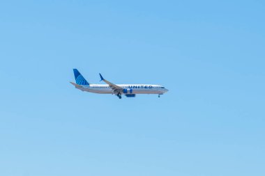 United Airlines Boeing 737-924ER N69830 landing on Boston Logan International Airport, Boston, Massachusetts MA, USA.  clipart