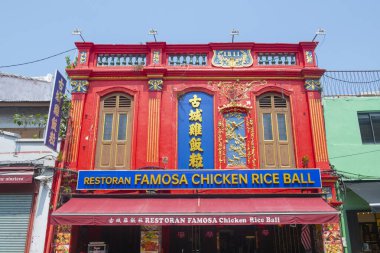 Famosa Chicken Rice Ball restaurant on Jalan Hang Jebat Street in historic city center of Melaka, Malaysia. Historic cities of the Straits of Malacca is a UNESCO World Heritage Site.  clipart