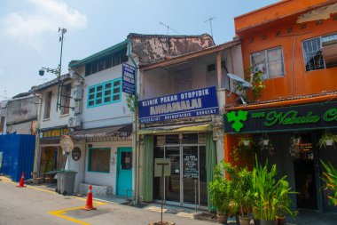 Historic commercial buildings on Lorong Hang Jebat Street in city center of Melaka, Malaysia. Historic cities of the Strait of Malacca is a World Heritage Site.  clipart