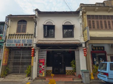 Historic commercial buildings on Lorong Hang Jebat Street in city center of Melaka, Malaysia. Historic cities of the Strait of Malacca is a World Heritage Site.  clipart