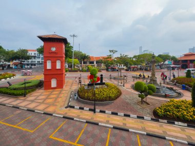 Tan Beng Swee Clock Tower and Stadthuys on Jalan Gereja Street at Dutch Square in city center of Melaka, Malaysia. Historic cities of the Strait of Malacca is a World Heritage Site. clipart