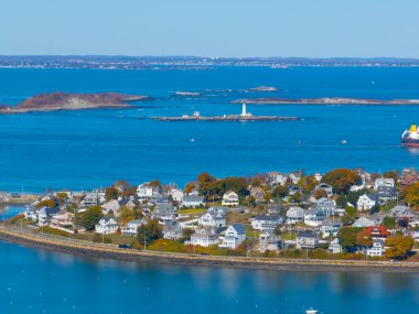 Allerton village aerial view with Boston Lighthouse on Little Brewster Island in Boston Harbor, town of Hull, Massachusetts MA, USA. clipart