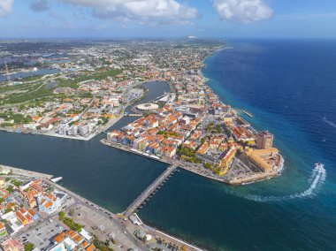 Willemstad historic city center aerial view including Otrobanda on the left and Punda on the right in city of Willemstad, Curacao. Historic Willemstad is a UNESCO World Heritage Site.  clipart