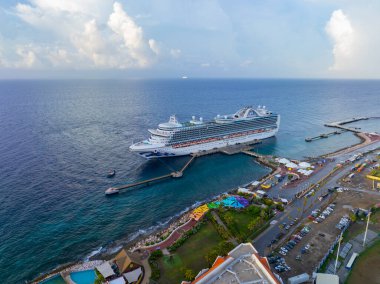 Emerald Princess aerial view by Princess Cruises docked at Curacao Cruise Terminal in Otrobanda, city of Willemstad, Curacao.  clipart