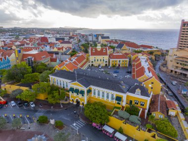 Willemstad historic city center aerial view including Fort Amsterdam in Punda in city of Willemstad, Curacao. Historic Willemstad is a UNESCO World Heritage Site.  clipart