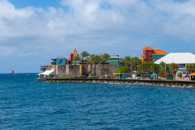 Renaissance Wild Creek Resort at Rif Fort at the mouth of Sint Anna Bay in Otrobanda, city of Willemstad, Curacao. Historic Willemstad is a UNESCO World Heritage Site.  clipart