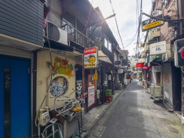 Historic restaurant and bar on Shinjuku Golden Gai Akarui Hanazono Ichiban Street in Shinjuku City, Tokyo, Japan.  clipart