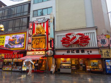 Large Crab model on Japanese style restaurant on Dotonbori Street in Namba District, Chuo ward, city of Osaka, Japan.  clipart