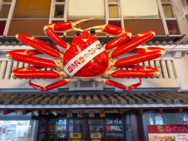 Large Crab model on Japanese style restaurant on Dotonbori Street in Namba District, Chuo ward, city of Osaka, Japan.  clipart