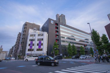 Modern commercial buildings on Edo dori Avenue at Umayabashi in Taito District, city of Tokyo, Japan.  clipart