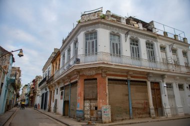 Historic buildings on Calle Cuba Street at Calle Acosta Street in Old Havana (La Habana Vieja), Cuba. Old Havana is a World Heritage Site.  clipart