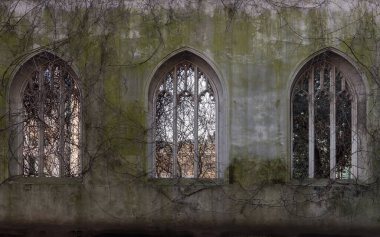 London, UK - Feb 27, 2024 - The ancient ruins church windows taken over by ivy growth of St Dunstan in the East Church Garden. The historic church was bombed and destroyed in the Second World War and is now a park, London city hidden places, Space fo clipart