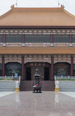 Bangkok, Thailand - Apr 11, 2024 - Exterior architecture of Taiwanese temple style and black incense burner at Fo Guang Shan Thaihua Temple is famous place. The Institute of Buddhism, Space for text, Selective focus. clipart