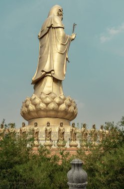 Bangkok, Thailand - Apr 11, 2024 - Big Golden statue goddess of Mercy Guanyin or Quan Yin statue at Fo Guang Shan Thaihua Temple. Guan Yin Buddha, Taiwanese temple style, Copy space, Selective focus. clipart