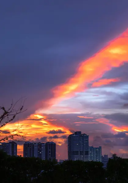 stock image Bangkok, Thailand - May 20, 2024 - Blue, Orange and Yellow sky over cityscape after sunset. Gorgeous scenic of city on sunset with beautiful cloud and sky, They can be used as Wallpaper, Space for text, Selective Focus.