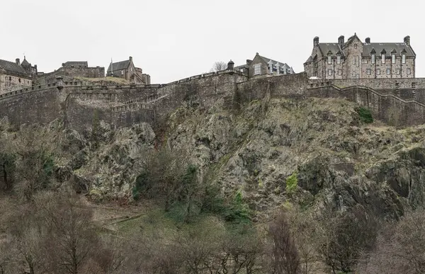 stock image Edinburgh, Scotland - Jan 16, 2024 - Scenic view of Edinburgh Castle at the top of the hill is a historic fortress and is one of the most popular tourist attractions in Edinburgh city. Copy space, Selective focus.