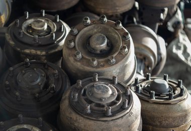 Close up of Old car axles and Many undercarriage parts at second hand parts car shop. Recycling, Copy space, Selective focus. clipart