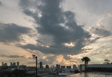 Bangkok, Thailand - 06 Aug 2024 - View of skyscrapers and dramatic sky before sunset. Beautiful clouds in the sky over large metropolitan city of bangkok, Copy space, Selective focus. clipart