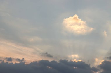 Dramatic clouds and shining form an interesting light pattern against the sky background before sunset. Concept idea of Imaginative clouds nature like a heaven for background wallpaper and Space composition, Nature abstract, clipart