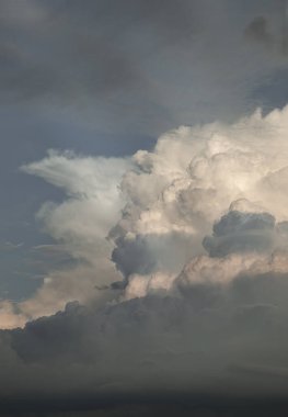 Dramatic clouds with blue sky background before sunset. The softness of the clouds and the brightness of the sky. Concept idea of Imaginative clouds and sky, Nature abstract composition, use it as your Wallpaper, Poster and Space for text, Selective  clipart