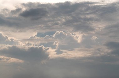 Dramatic clouds with blue sky background before sunset. The softness of the clouds and the brightness of the sky. Concept idea of Imaginative clouds and sky, Nature abstract composition, use it as your Wallpaper, Poster and Space for text.