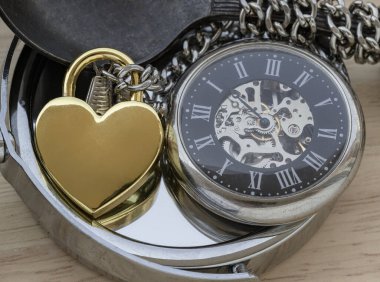 Golden heart shaped love padlock and A retro pocket watch on round mirror. Love can endure beyond the limitations of time, Concept of Love that transcends time, Valentine's day, use it as your Space for text, Design, Wallpaper and Poster, Selective f clipart