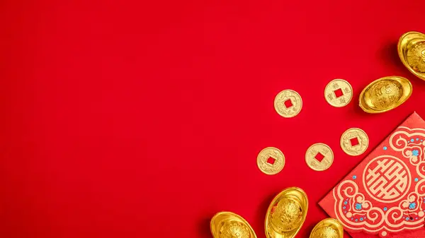 red envelope, ang pow, red packet with ancient Chinese ingot gold bar, Golden Chinese Ancient Feng Shui Lucky Coin for Wealth Money. Chinese Lunar New Year celebration background with copy space