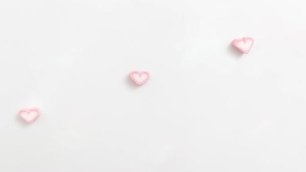Looping Filmagem Padrão Fundo Marshmallow Forma Coração Marshmallow Rosa Pastel — Vídeo de Stock