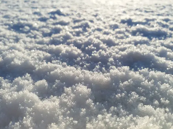 stock image White snow in the rays of the dawn sun. Winter beauty that amazes the imagination. Small snowflakes