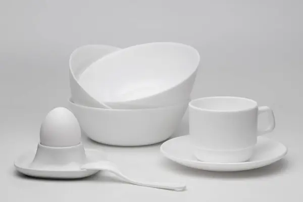 White ceramic dishes on a white background